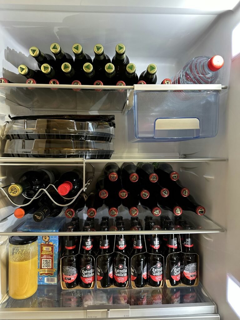 The Garage Refrigerator: A Timeline of Transformation from Grocery Overflow to Beverage Base